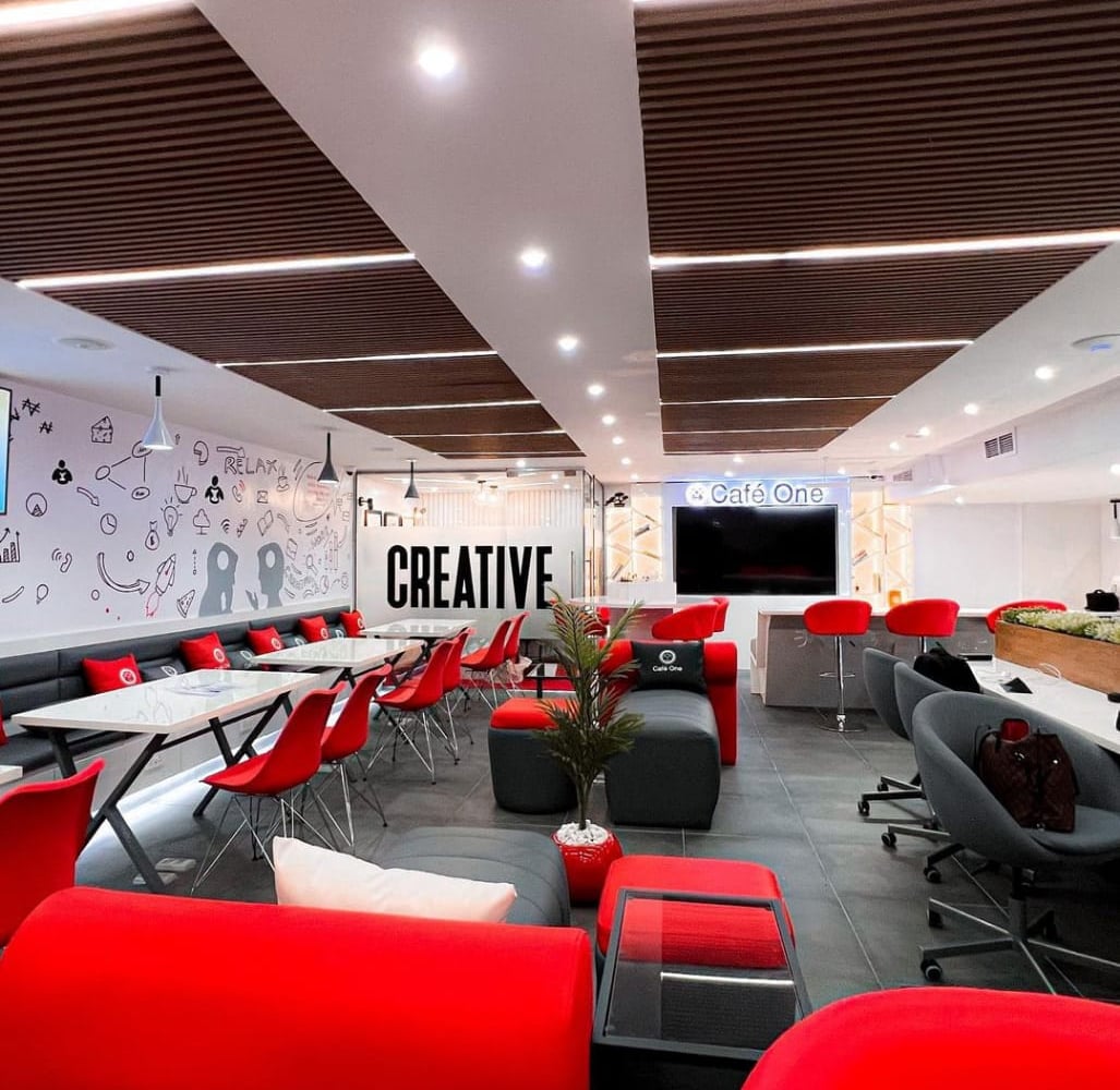 Interior of Café One Yaba with tables and lounge seating